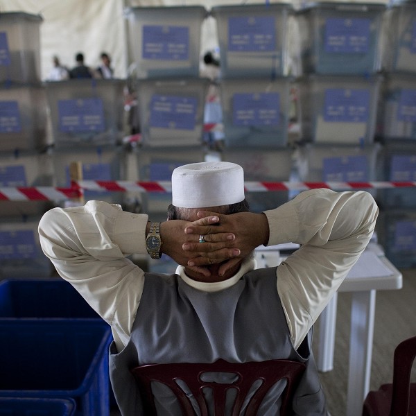 Afghan election workers stack ballot boxes at Afghanistan's Independent Election Commission in Kabul (AP)