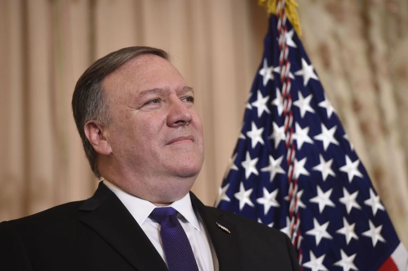 Mike Pompeo looks on as US President Donald Trump speaks during the ceremonial swearing-in of US Secretary of State Mike Pompeo at the State Department in Washington, DC, May 2, 2018. (Photo by SAUL LOEB / AFP)        (Photo credit should read SAUL LOEB/AFP/Getty Images)